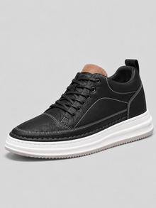 Men's black leather-look platform trainers with white sole, side view