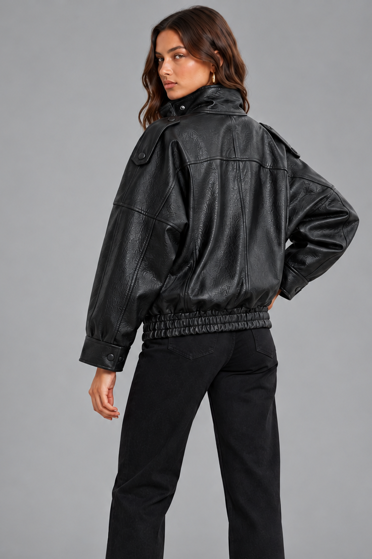 Women's oversized black faux leather bomber jacket, back view