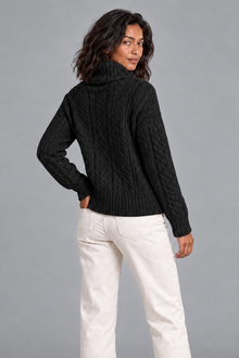 Women's black cable knit turtleneck sweater, back view