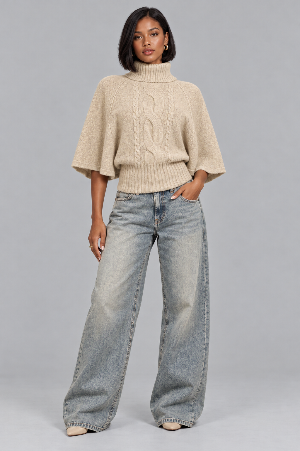 Women's beige cable knit turtleneck jumper, full-length look with wide leg jeans