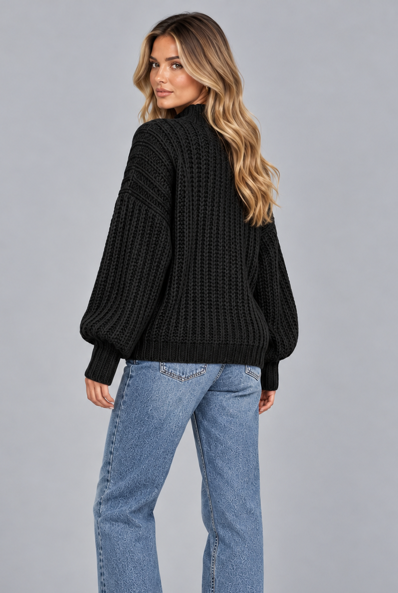 Women's black chunky cable knit jumper, front view