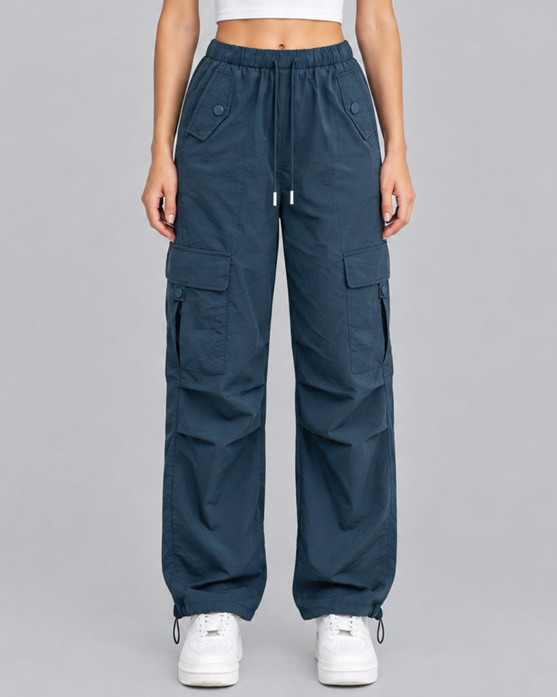 Women's blue cotton parachute cargo trousers with drawstring waist, front view