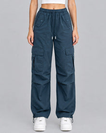 Women's blue cotton parachute cargo trousers with drawstring waist, front view