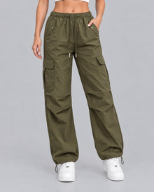 Women's green cotton parachute cargo trousers with drawstring waist, front view