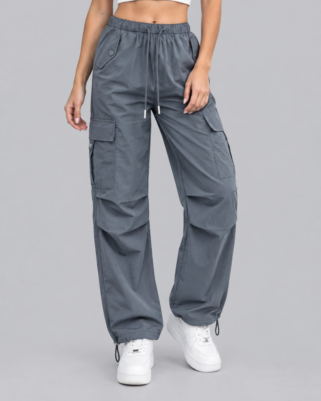 Women's grey cotton parachute cargo trousers with drawstring waist, front view
