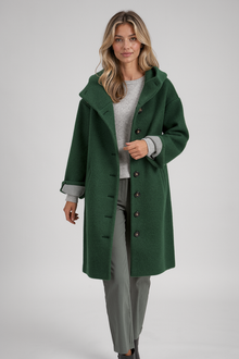Heather women's hooded long coat in green – walking view
