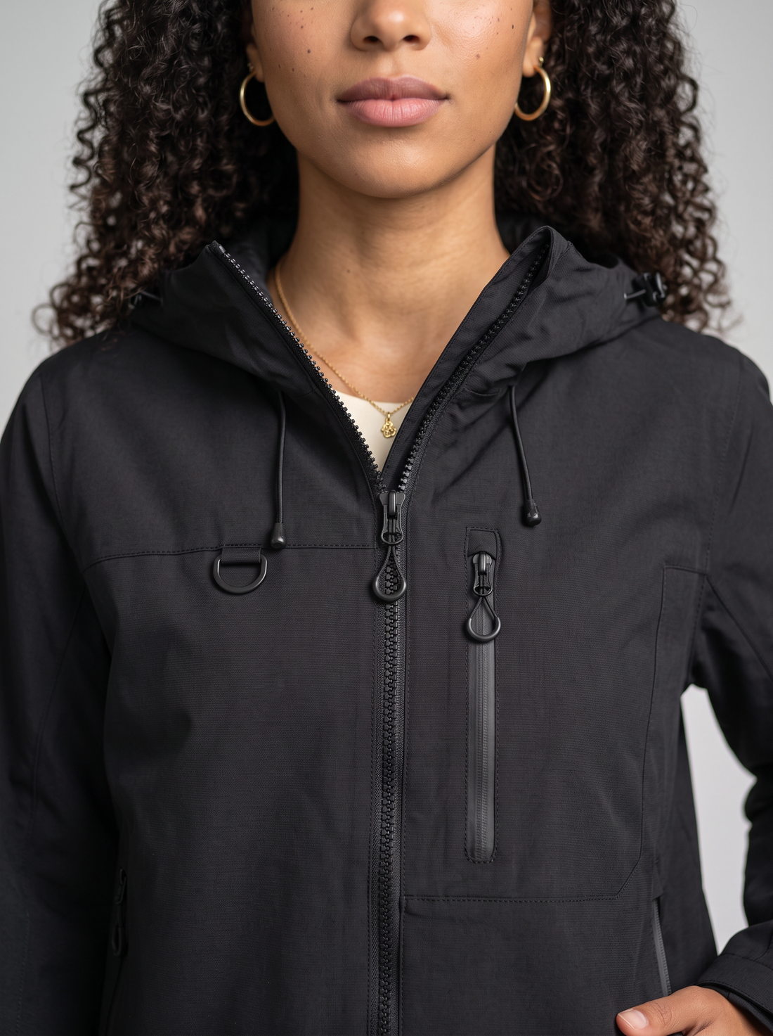 Women's Short Hooded Waterproof Raincoat in Black – three-quarter view