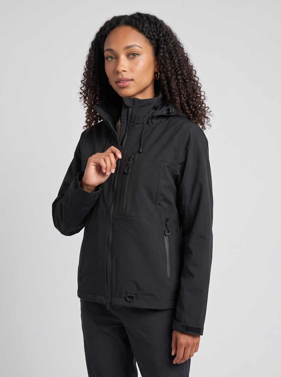 Women's Short Hooded Waterproof Raincoat in Black – three-quarter view