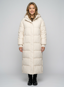 Women's Long Quilted Puffer Coat in Cream – front view