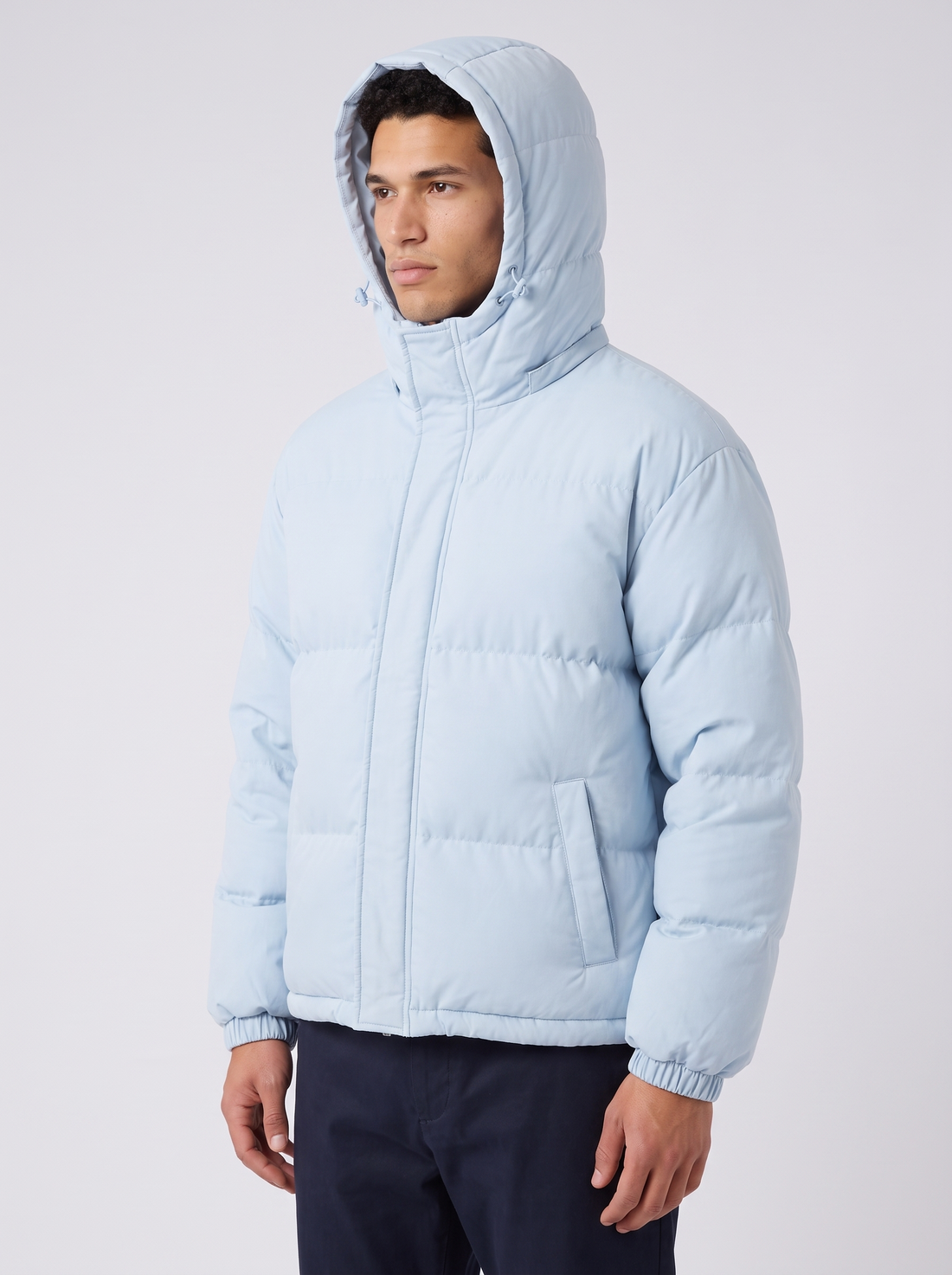 Unisex Oversized Hooded Puffer Jacket in Black – three-quarter view