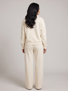 Women's half zip lounge set in cream, back view
