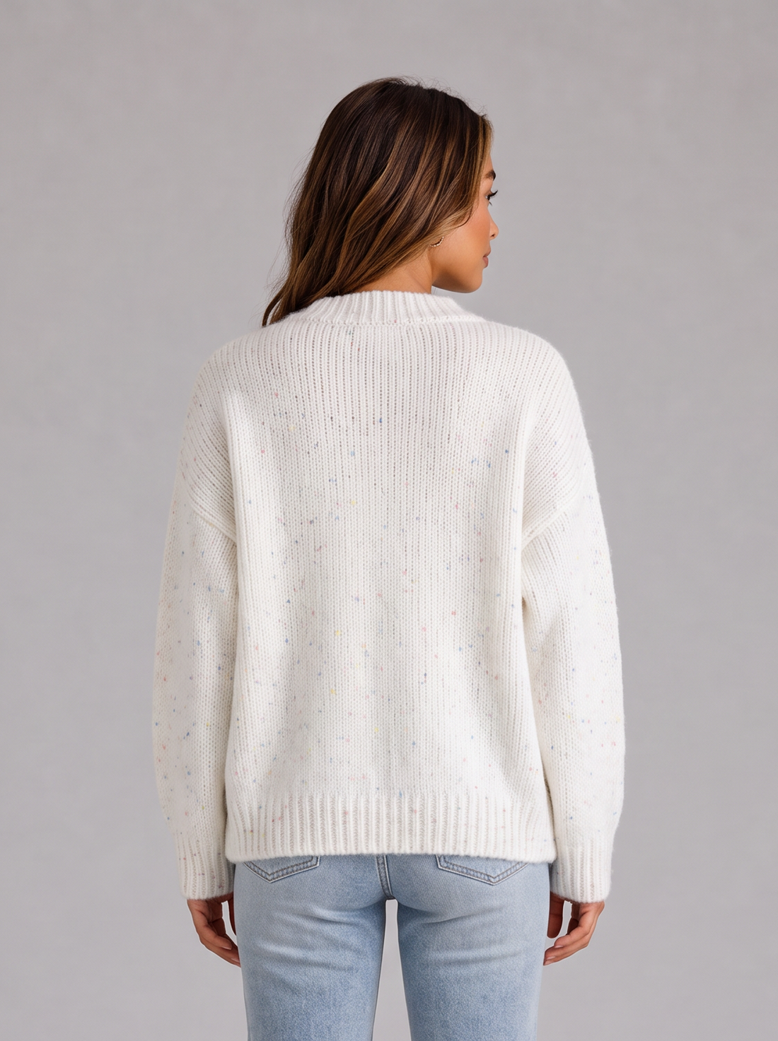Model wearing ivory white fluffy knit button front cardigan with jeans, front view