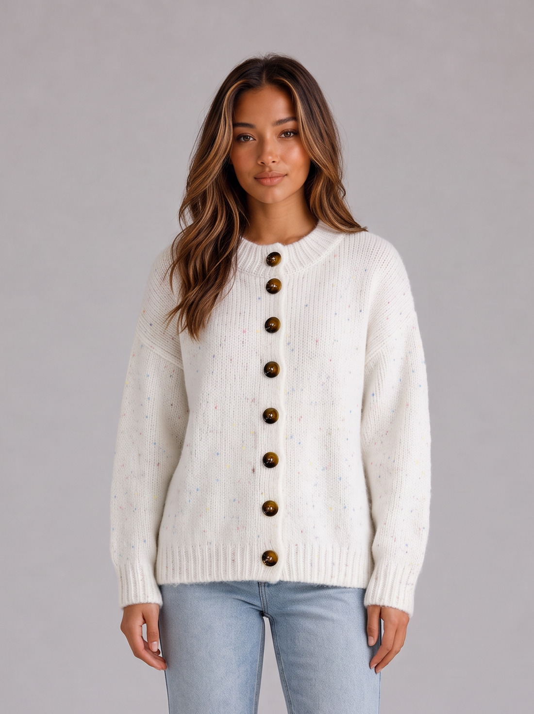 Model wearing ivory white fluffy knit button front cardigan with jeans, front view