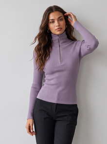 Woman wearing purple ribbed roll neck long sleeve top with collar zip and black trousers