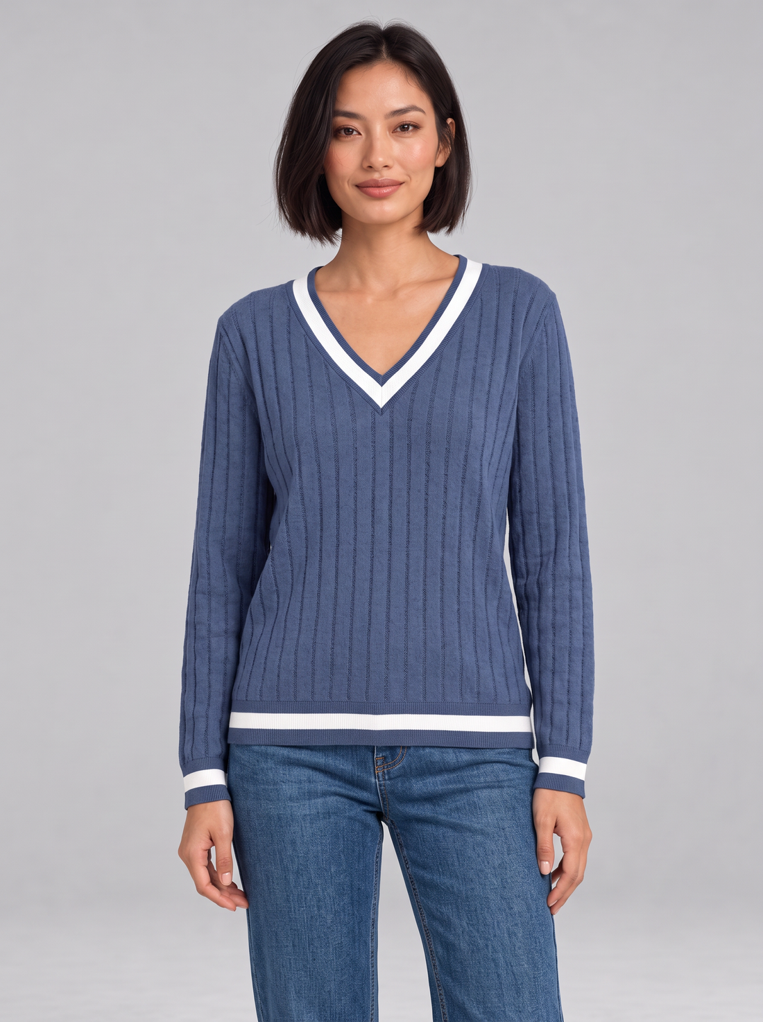 Woman wearing ribbed V-neck jumper with contrast trim in violet blue, front view