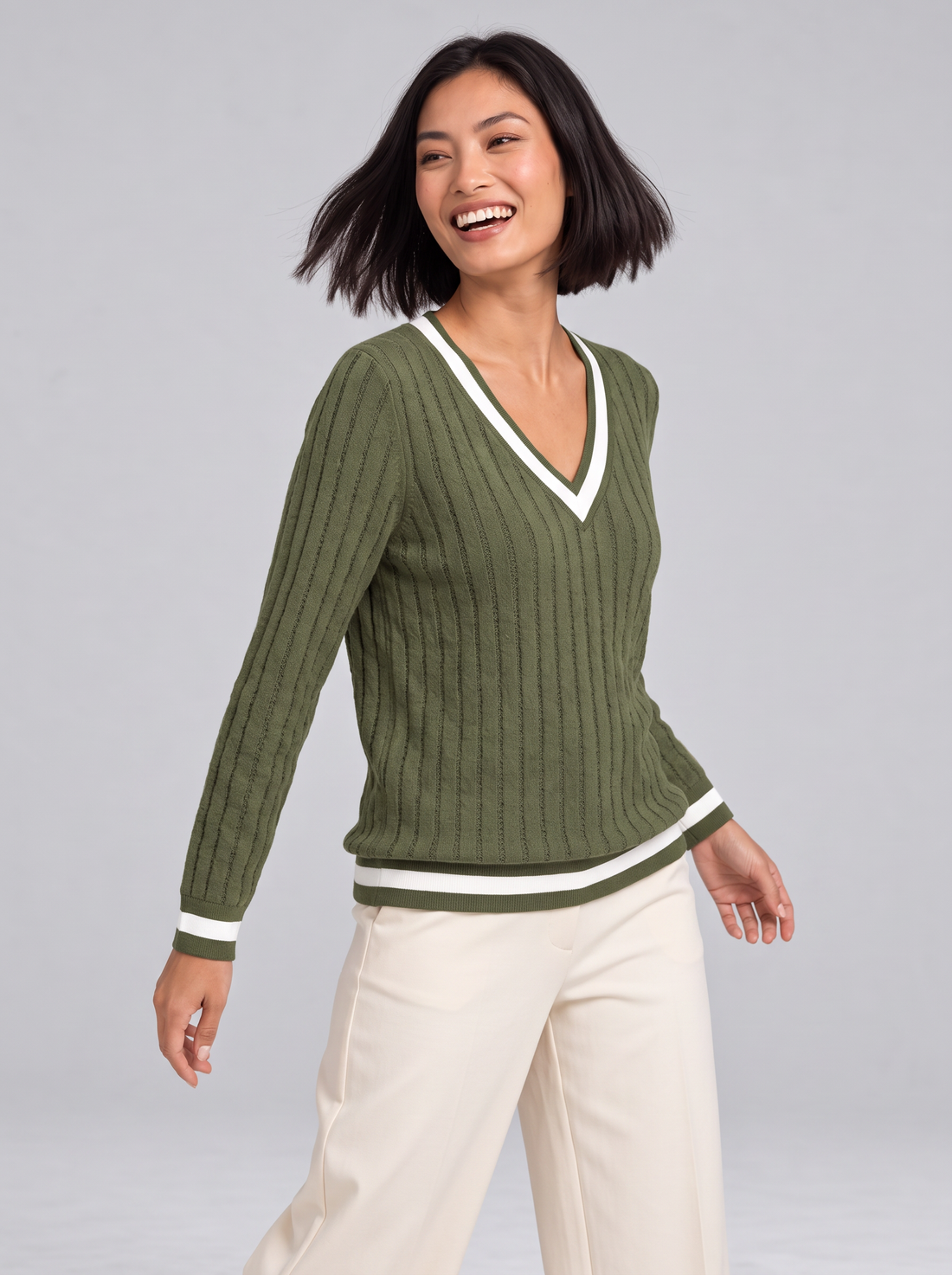 Woman wearing ribbed V-neck contrast trim jumper in green