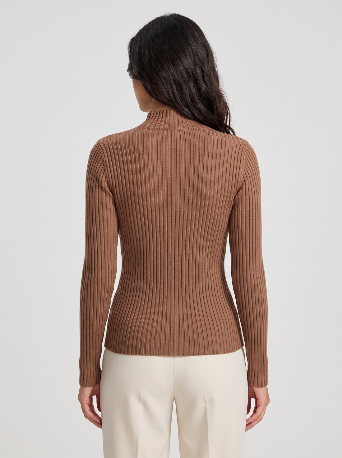 Woman wearing brown slim fit ribbed mock neck jumper, front view