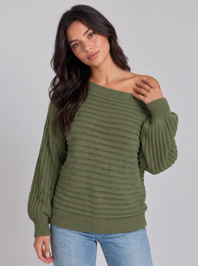 Woman wearing olive green off-shoulder ribbed batwing jumper