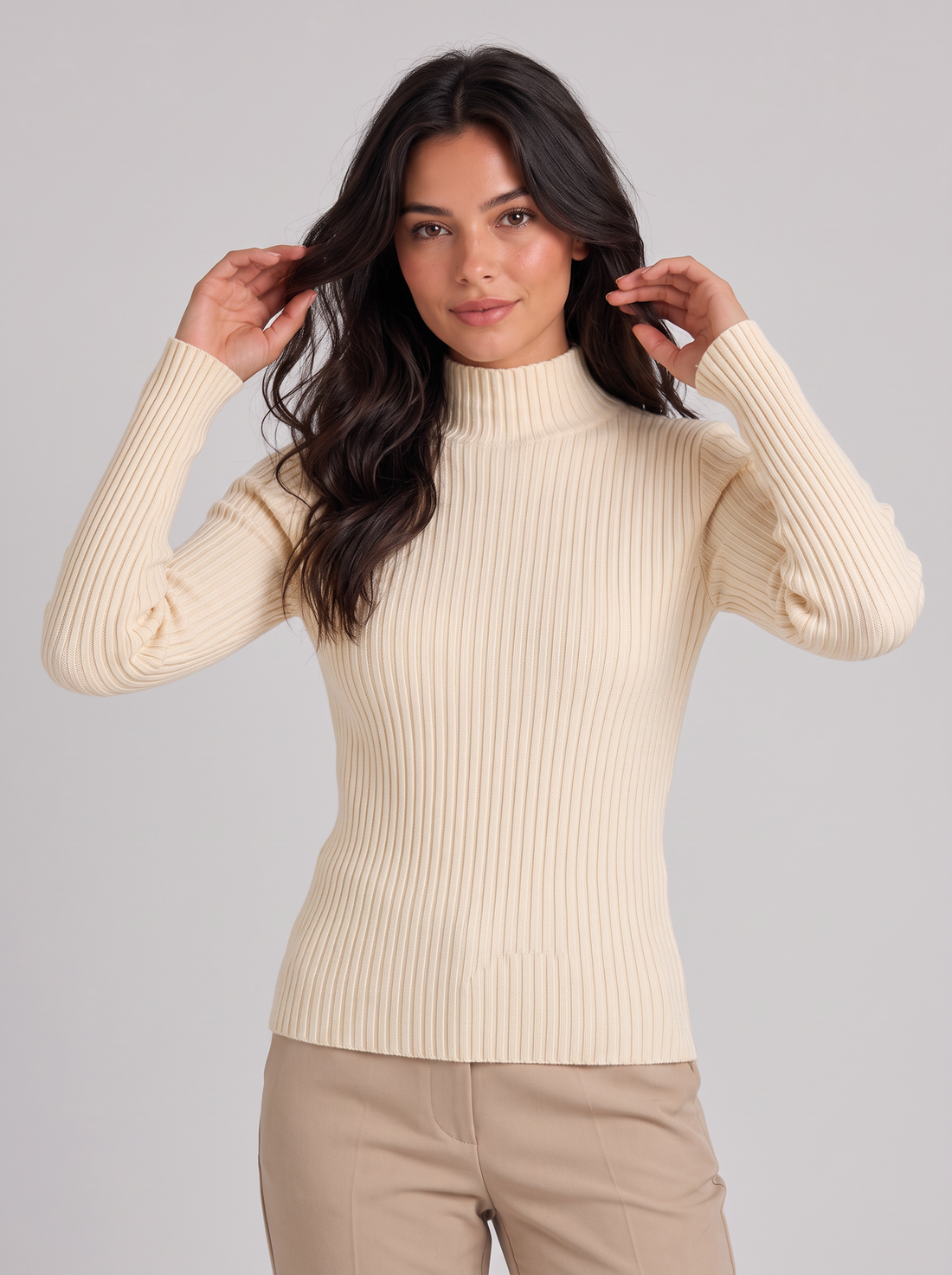 Woman wearing apricot slim fit ribbed mock neck jumper