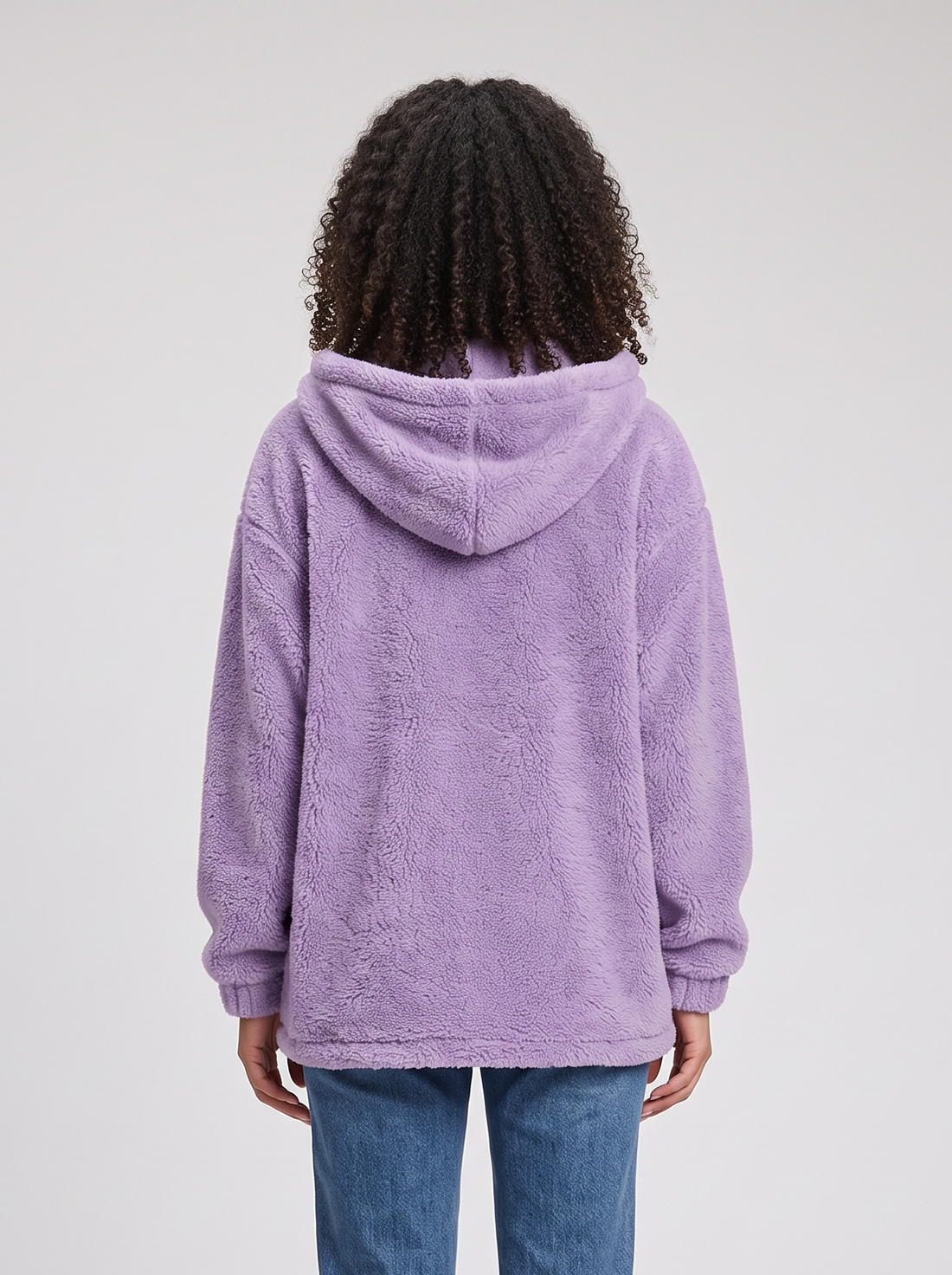 Woman wearing lilac hooded teddy fleece cardigan with pockets, front view