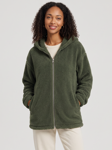 Woman wearing dark green hooded teddy fleece cardigan with pockets