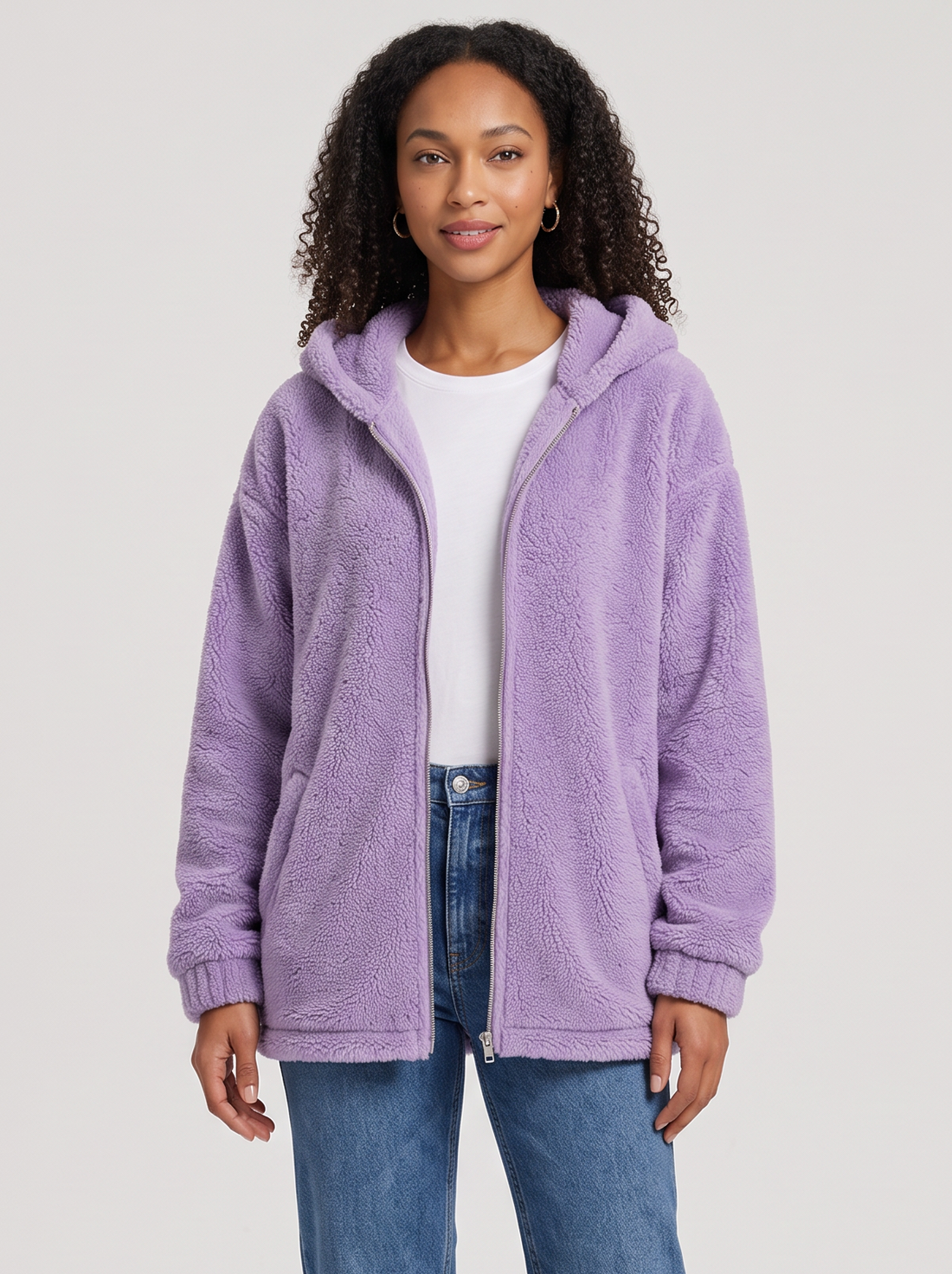 Woman wearing lilac hooded teddy fleece cardigan with pockets, front view