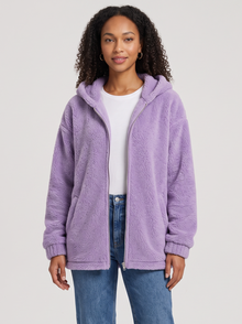 Woman wearing lilac hooded teddy fleece cardigan with pockets, front view