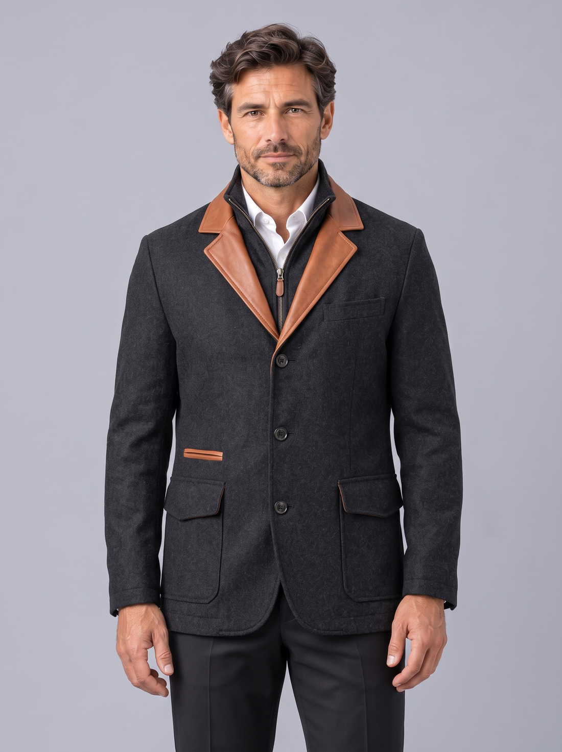 Man wearing black vintage field jacket with tan contrast trim, front view