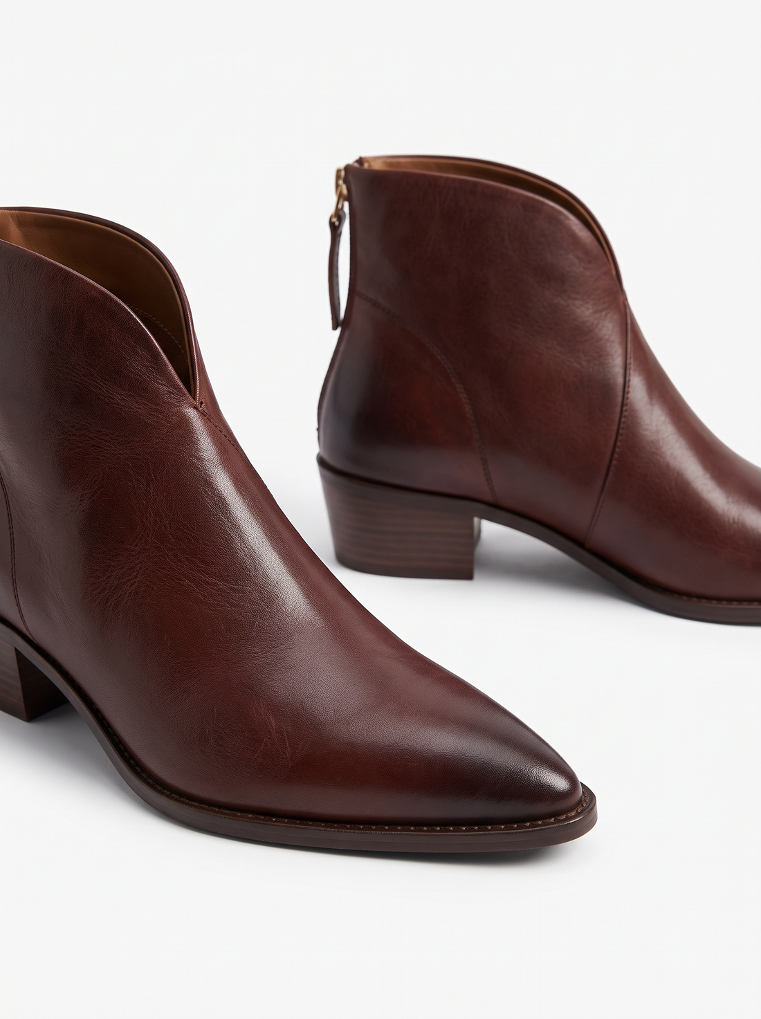 Close-up of brown vegan leather pointed toe ankle boots
