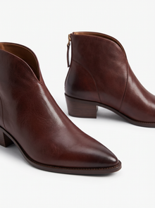 Close-up of brown vegan leather pointed toe ankle boots