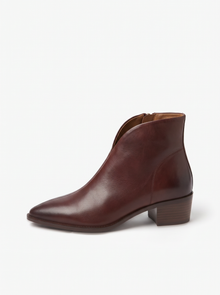Side view of brown pointed toe ankle boot with V-cut collar