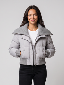 Gray cropped puffer jacket with ribbed knit collar on model
