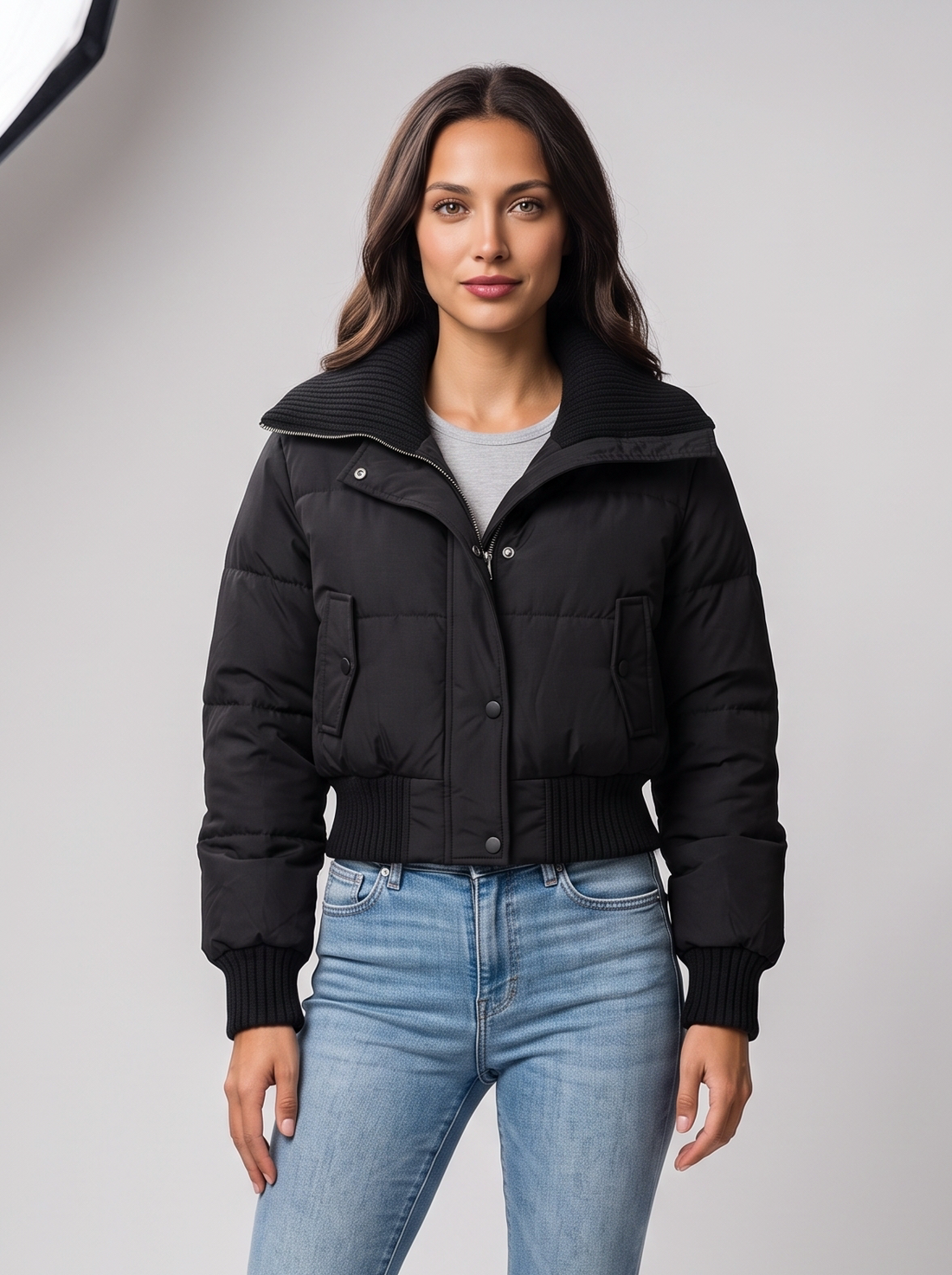 Black cropped puffer jacket with ribbed knit collar on model
