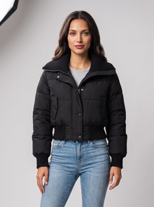 Black cropped puffer jacket with ribbed knit collar on model