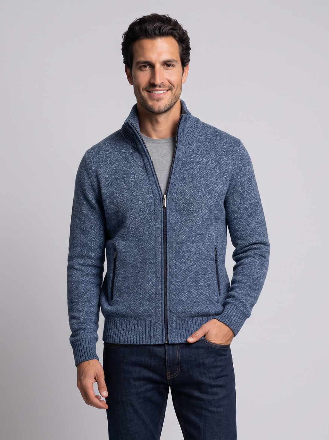 Man wearing blue merino wool full-zip cardigan with high collar, front view