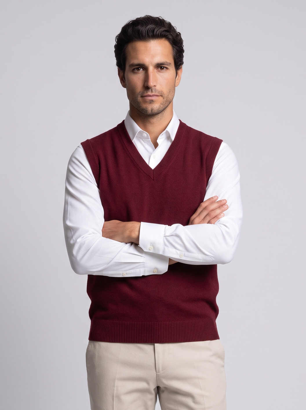 Man with arms crossed in burgundy merino wool sweater vest