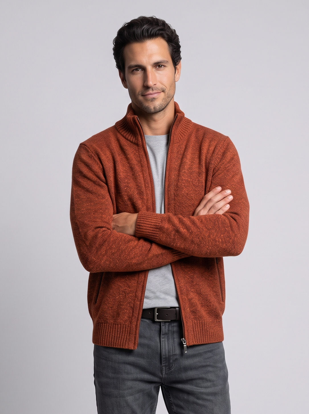 Man with arms crossed in orange merino wool full-zip cardigan
