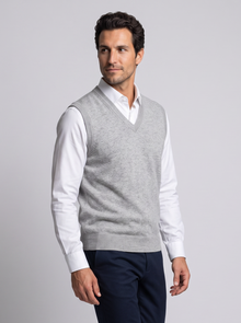 Man walking in grey merino wool sweater vest