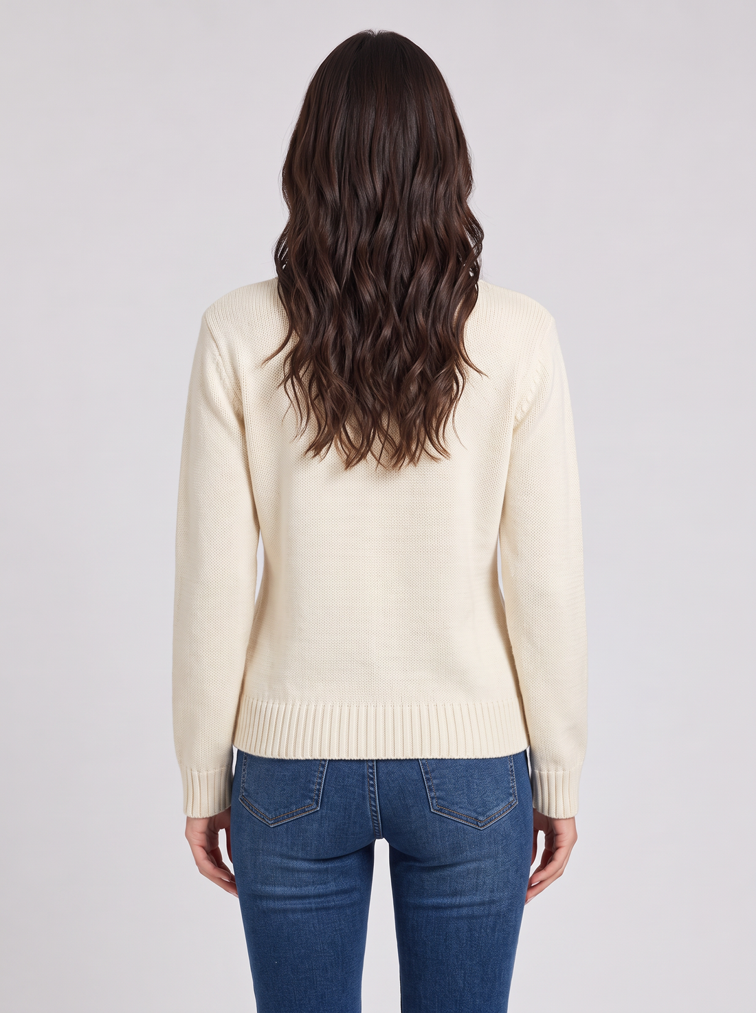 Woman wearing cream teddy bear Christmas sweater with tree appliqué, front view