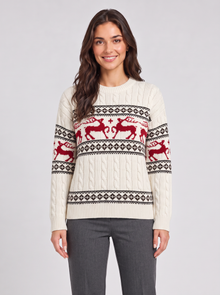 Woman wearing ivory Fair Isle Christmas sweater with red reindeer, front view