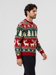 Men's red Christmas jumper with reindeer and tree pattern, side view