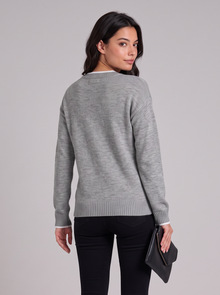 Women's grey snowflake knit sweater, back view