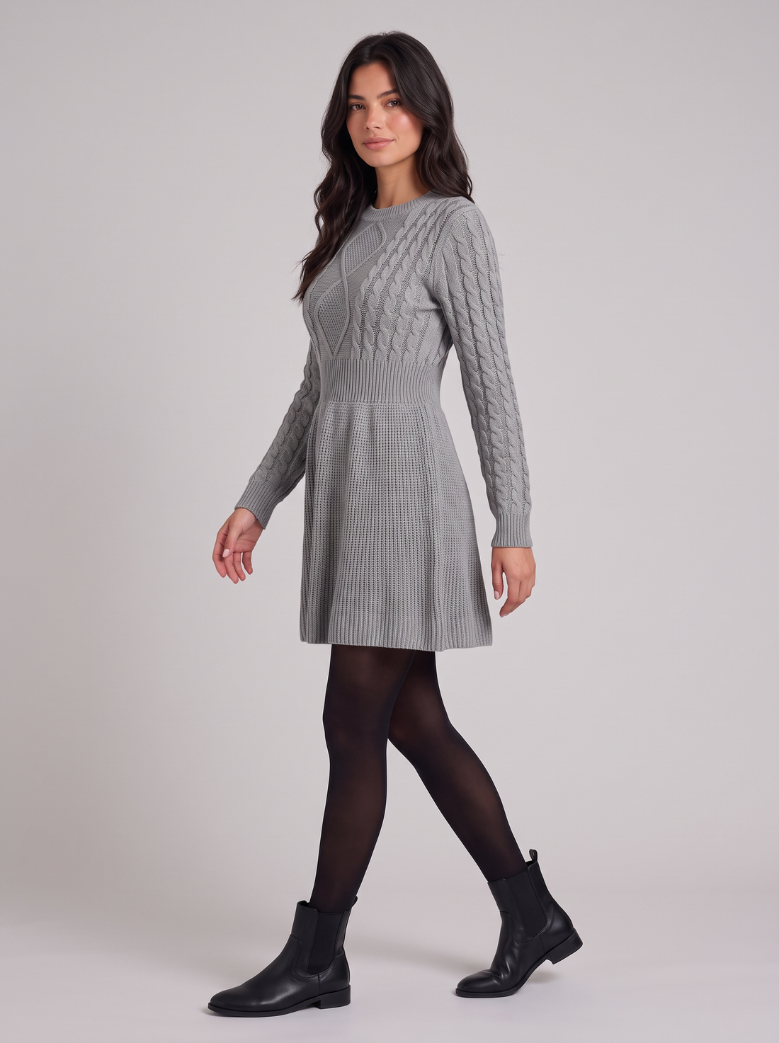 Women's grey cable-knit sweater dress, side view