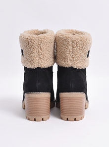 Women's black suede ankle boots with sherpa cuff, back view
