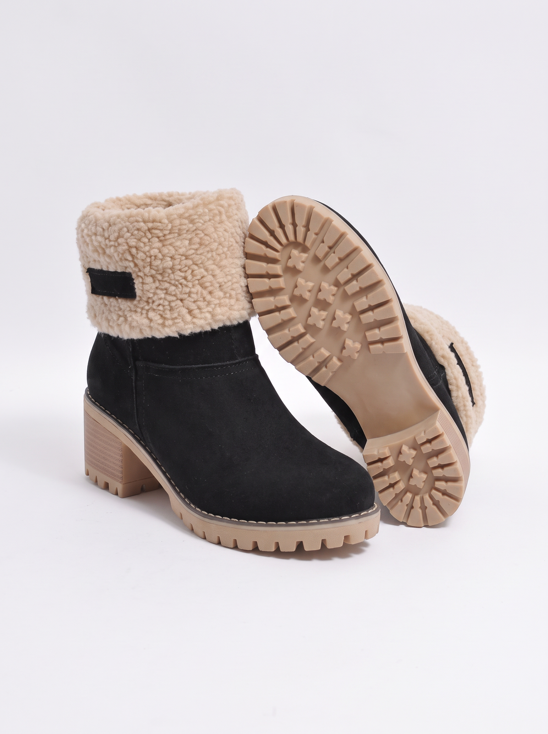 Black heat-lined boots showing the chunky grip outsole