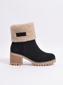 Women's black suede ankle boot with block heel, side view