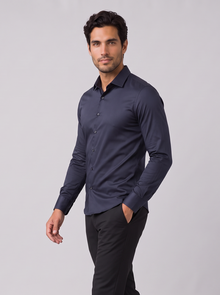 Men's navy slim fit satin-look stretch dress shirt, side view walking