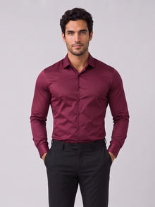 Men's burgundy slim fit satin-look stretch dress shirt worn with black trousers, front view