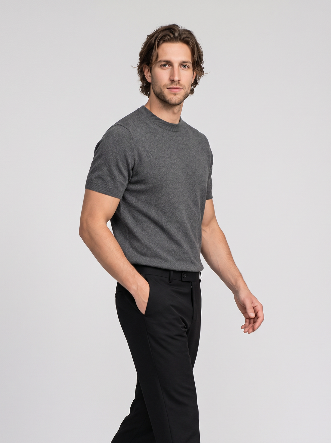 Men's dark grey knit crew neck t-shirt, side view walking