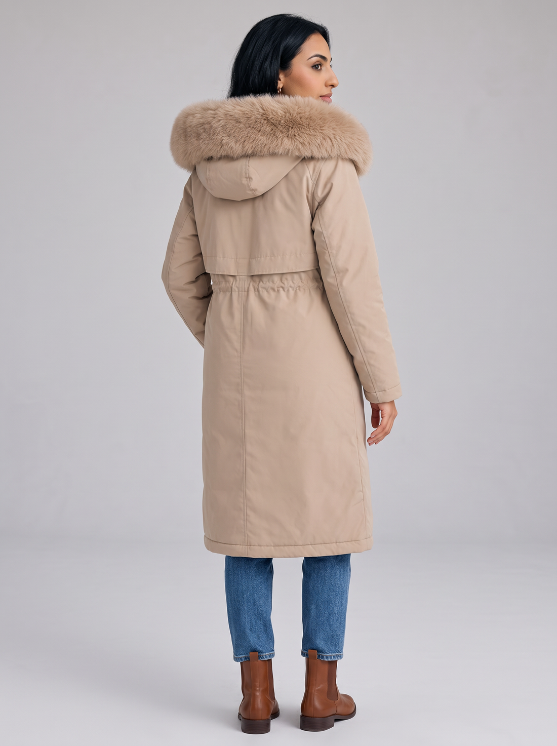 Women's beige long hooded winter coat with faux fur trim, front view